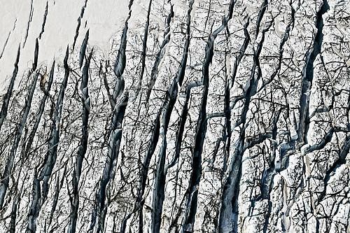 Biosphoto | 2355761 | Aerial view, ice crevices and structures of volcanic ash and black lava in the ice and snow of the Vatnajoekull glacier, Iceland, Europe | &copy; Michael Peuckert / imageBROKER / Biosphoto