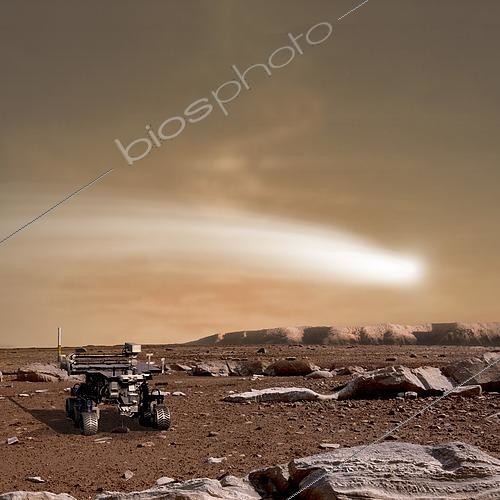 Biosphoto | 2483337 | An artist's depiction of the close pass of comet C/2013 A1 over the Martian landscape. Also known as comet Siding Spring, which is the Australian observatory that discovered the object, it is scheduled to pass by Mars in October of 2014. Rover image courtesy of NASA. | © Marc Ward / Stocktrek Images / Biosphoto