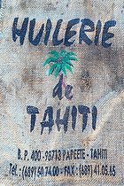 Biosphoto | 2089401 | Bag and emblem of the oil mill of Tahiti, unique manufacturer of coconut oil, especially for the manufacture of Monoï de Tahiti AOC, Papeete, French Polynesia | &copy; Laurent Lhoté / Biosphoto