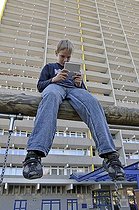 Biosphoto | 1605592 | Boy, 9, playing with his Nintendo in front of a high-rise apartment building, satellite town of Chorweiler in Cologne, North Rhine-Westphalia, Germany, Europe | © Walter G. Allgoewer / imageBROKER / Biosphoto