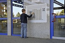 Biosphoto | 1605600 | Boy, 9, standing in front of the doorbell panel of a high-rise apartment building, satellite town of Chorweiler in Cologne, North Rhine-Westphalia, Germany, Europe | © Walter G. Allgoewer / imageBROKER / Biosphoto
