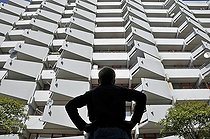 Biosphoto | 1605609 | Boy standing in front of a high-rise apartment building with balconies and satellite dishes, satellite town of Chorweiler in Cologne, North Rhine-Westphalia, Germany, Europe | © Walter G. Allgoewer / imageBROKER / Biosphoto