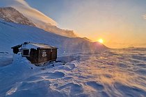 Biosphoto | 2602139 | Cabin under the blizzard at sunset at Cape Brewster, Scoresby Strait, ScoresbySund, Greenland | &copy; Pierre Vernay / Biosphoto