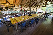 Biosphoto | 2583261 | Camp inselberg, scientific station in the Nouragues nature reserve. Common carbet used as kitchen and office at Camp Inselberg, a convivial space in the middle of the Amazon rainforest - Régina, French Guiana. | &copy; Vincent Premel / Biosphoto