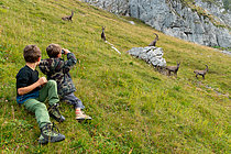 Biosphoto | 2550527 | Children watching Alpine Ibex (Capra ibex) in the French Alps. | &copy; Olivier Born / Biosphoto
