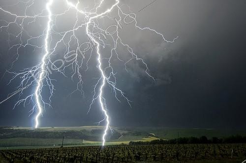 Biosphoto | 2025458 | Close lightning strikes in the countryside - France  ; Lightning strike to 0,950 km and 1,200 km from the photographer.  | &copy; Xavier Delorme / Biosphoto