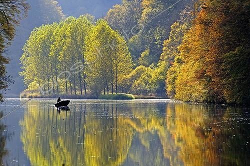 Biosphoto | 1480240 | Fisherman in a boat in the fall Doubs Valley France | © Dominique Delfino / Biosphoto