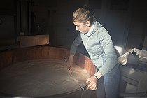 Biosphoto | 2561130 | France, Haute-Savoie, La Clusaz, 2023-03-26. Young woman farmer, sister of Lucas, making curd by inserting rennet into cow's milk to produce reblochon. EDITORIAL ONLY. Photograph by Antoine Boureau. | &copy; Antoine Boureau / Biosphoto
