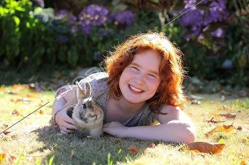 Biosphoto | 1962727 | Girl with her dwarf rabbit | &copy; Hélène & Jean-Michel Sotto / Biosphoto