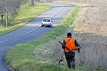 Biosphoto | 1251521 | Hunter and his dog at the roadside to Vandoncourt France | &copy; Dominique Delfino / Biosphoto