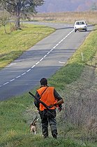Biosphoto | 1251522 | Hunter and his dog at the roadside to Vandoncourt France | &copy; Dominique Delfino / Biosphoto