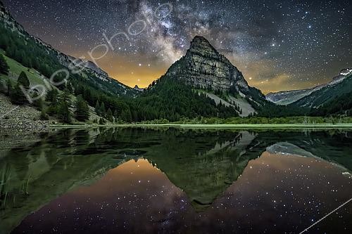 Biosphoto | 2610279 | Lac des Sagnes on a summer's night in Ubaye. The Milky Way takes shape in the middle of the night above the lake and the Tour des Sagnes in Ubaye, in the southern Alps. Hautes-Alpes, France | © Jean-Philippe Delobelle / Biosphoto