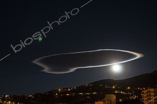 Biosphoto | 2593261 | Lenticular cloud, lined with a moon photometeor with green moon projection, ville di Pietrabugno, Corsica, France | &copy; Hyacinthe Sambroni / Biosphoto