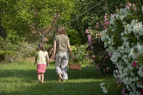 Biosphoto | 1423520 | Little girl and her mother walking in a garden | &copy; Marc Chatelain / Biosphoto