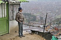 Biosphoto | 1606372 | Man, civil war refugee and victim of forced displacement, in front of his derelict house in the Altos de la Florida slum, Soacha, Bogota, Cundinamarca, Colombia, South America | © Florian Kopp / imageBROKER / Biosphoto