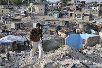 Biosphoto | 1604142 | Man in the rubble of the slums of Fort National, the district was largely destroyed by the earthquake in January 2010, Port-au-Prince, Haiti, Caribbean, Central America | © Florian Kopp / imageBROKER / Biosphoto