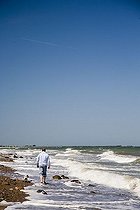 Biosphoto | 1487694 | Man walking with a dog along a beach on the Baltic Sea | &copy; Ariane Lohmar / imageBROKER / Biosphoto