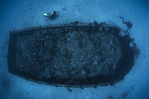 Biosphoto | 2609373 | Military barge lying in 20 metres of water and divers, one of the rare wrecks in Mayotte's lagoon. | &copy; Gabriel Barathieu / Biosphoto