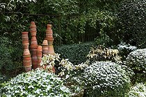 Biosphoto | 2026967 | Mock orange 'Nana' topiaries under snow in a city garden | &copy; Philippe Giraud / Biosphoto