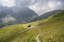 Biosphoto | 2588047 | Mountain landscape, hiking trail and Arbaretan refuge under a stormy sky in the Belledonne massif in the Alps in Saint Alban des Hurtieres, France. | &copy; Antoine Boureau / Biosphoto
