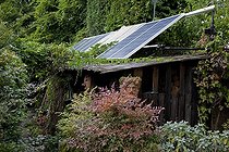 Biosphoto | 1250597 | Photovoltaic solar panels on a shed in an organic garden | &copy; NouN / Biosphoto