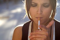 Biosphoto | 1251158 | Portrait of a young woman lighting a cigarette Spain  | &copy; Nano Calvo / Visual and Written - Photo Collection / Biosphoto