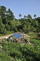 Biosphoto | 1604325 | Shell of an earthquake-proof timber-framed house, which a German aid organization donated to victims of the January 2010 earthquake, Coq Chante village near Jacmel, Haiti, Caribbean, Central America | © Florian Kopp / imageBROKER / Biosphoto