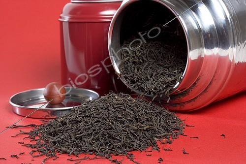 Biosphoto | 545222 | Tea and its box on a red background | &copy; John S. Sutton / Green Eye / Biosphoto