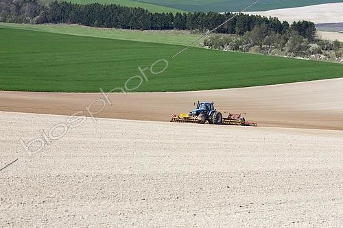 Biosphoto | 2576097 | Tractor coupled to front and rear rotary harrows and scarifiers prepares fine soil for precision sowing, Large-scale cultivation on calcareous loam soil, in a landscape in the Marne region, France | &copy; Claudius Thiriet / Biosphoto