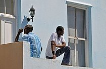 Biosphoto | 1601947 | Two men in front of a house in Bo-Kaap the tradional muslim city district in Cape Town, South Africa, Africa | © Walter G. Allgoewer / imageBROKER / Biosphoto