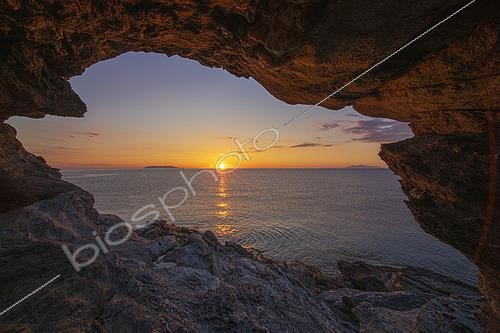 Biosphoto | 2593232 | View of the grotto known as Oyster Rock, not far from Pietracorbara beach. Oyster Rock, on the east coast of Cap Corse, facing the Tyrrhenian Sea and the two islands of the 7-member Tuscan archipelago. On the left is the island of Capraia and on the right, the island of Elba. Corsica, France | &copy; Hyacinthe Sambroni / Biosphoto