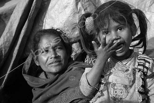 Biosphoto | 1072254 | Woman and girl licking fingers Kathmandu Nepal | &copy; Antoine Boureau / Biosphoto