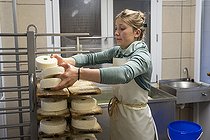 Biosphoto | 2561141 | Young 20-year-old woman farmer involved in the production of Reblochon cheese on a family farm producing free-range Reblochon cheese, La Clusaz, Haute-Savoie, France | &copy; Antoine Boureau / Biosphoto