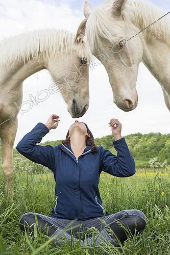Biosphoto | 2578926 | Young girl and white horses in a meadow, France | &copy; Claudius Thiriet / Biosphoto
