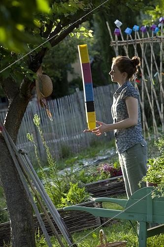 Biosphoto | 1368213 | Young girl playing with pots in a kitchen garden | &copy; Philippe Giraud / Biosphoto