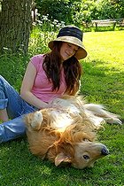 Biosphoto | 1464376 | Young woman is playing with a golden retriever dog in the garden | &copy; Benjamin Redeleit / imageBROKER / Biosphoto