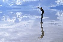 Biosphoto | 1607069 | Young woman reflecting on the surface of the flooded salt desert Salar de Uyuni, Bolivia | &copy; Florian Kopp / imageBROKER / Biosphoto