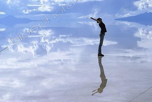 Biosphoto | 1607069 | Young woman reflecting on the surface of the flooded salt desert Salar de Uyuni, Bolivia | &copy; Florian Kopp / imageBROKER / Biosphoto